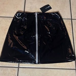 Fashion Nova “up to you black mini skirt” size Large